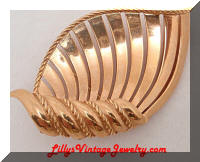 Trifari golden scrolling shell brooch