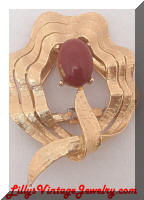 Golden red-ish brown cab dress clip brooch