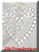 Rhinestones scrolling heart brooch