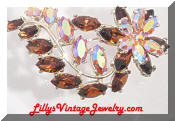 Amber ab rhinestones floral comet brooch